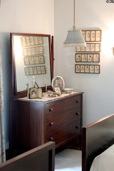 Dresser with baby portraits of Kennedy children in master bedroom at John F. Kennedy NHS. Boston, MA.