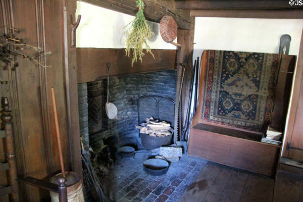 Fireplace with settle at John Balch Museum House. Beverly, MA.