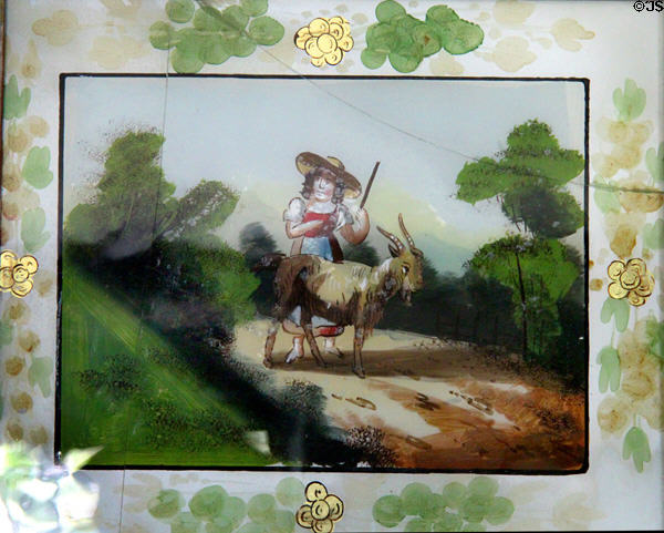 Painted glass panel with woman & goat on looking glass at Jeremiah Lee Mansion. Marblehead, MA.