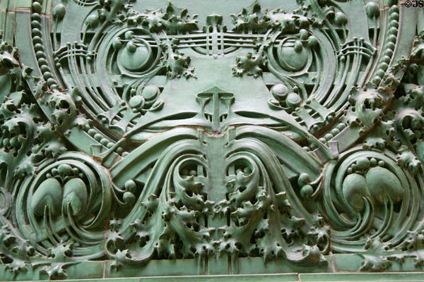 Leaves & scroll details over entrance of National Farmer's Bank. Owatonna, MN.
