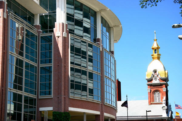 Curved front of 333 W 11th St. with Cathedral of Immaculate Conception beyond. Kansas City, MO.
