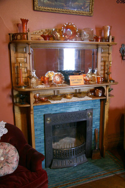 Fireplace with carnival glass collection in Copper King Mansion. Butte, MT.