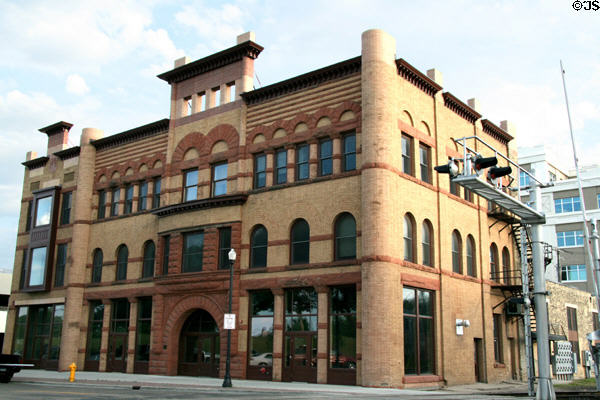 Heritage Romanesque Revival building (1891) on South 3rd St. at Kitson St. rail tracks. Grand Forks, ND. Style: Richardsonian Romanesque. On National Register.