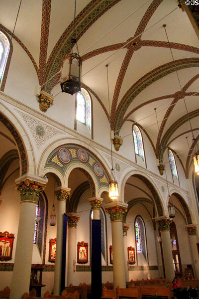 Aisles in St. Francis Cathedral with Clermont-Ferrand, France stained glass windows (1884). Santa Fe, NM.