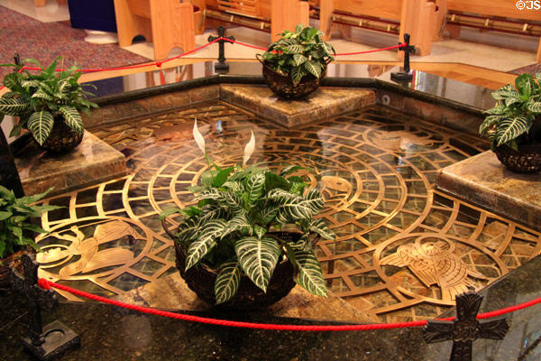 Baptismal font (2001) with symbols of Evangelists in St Francis Cathedral. Santa Fe, NM.