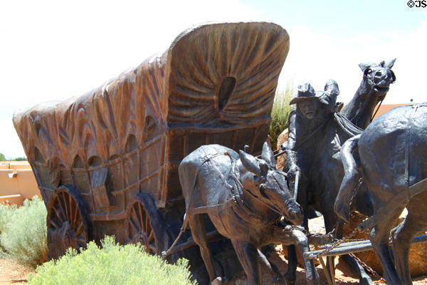 Mules stumble pulling wagon in Journey's End Santa Fe Trail Monument. Santa Fe, NM.