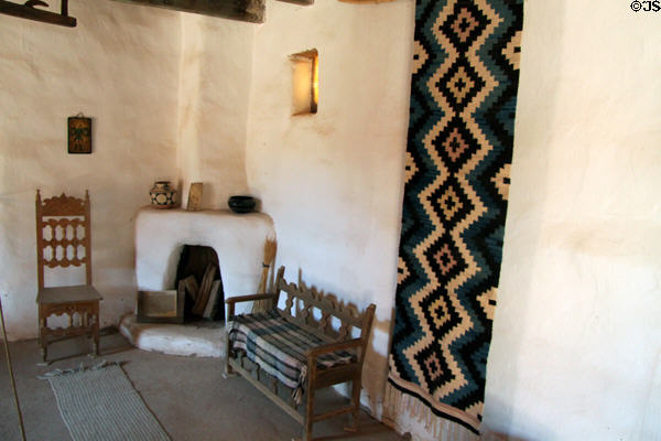 Corner fireplace & seats of reception room in La Placita at Rancho de las Golondrinas. Santa Fe, NM.