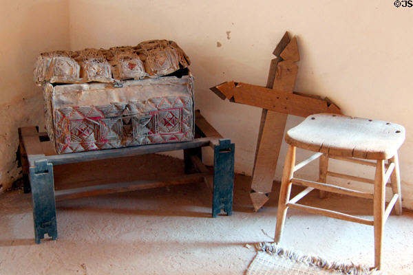 Trunk, cross & stool in La Placita at Rancho de las Golondrinas. Santa Fe, NM.