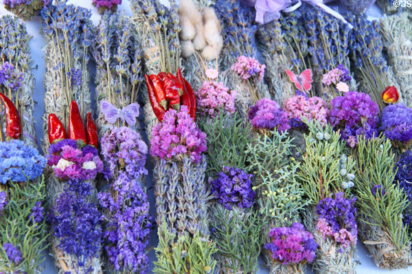 Flowers & bunches of sages at Sunday Santa Fe Farmers Market. Santa Fe, NM.