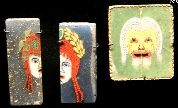 Ancient glass plaques with Greek drama characters at Corning Museum of Glass. Corning, NY.