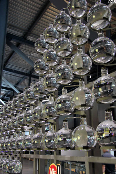 Wall of glass flasks at Corning Museum of Glass. Corning, NY.