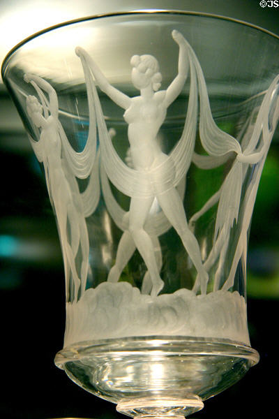 Detail of Steuben engraved glass goblet with dancing nudes at Corning Museum of Glass. Corning, NY.