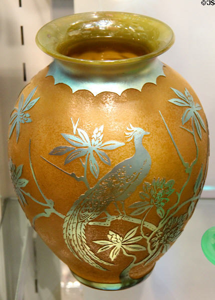 Acid-etched decoration on glass vase with bird on branch by Steuben Glass at Corning Museum of Glass. Corning, NY.