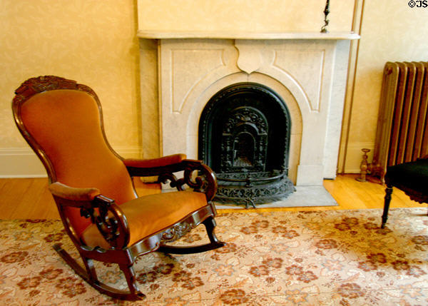Marble fireplace & rocking chair at Susan B. Anthony House. Rochester, NY.