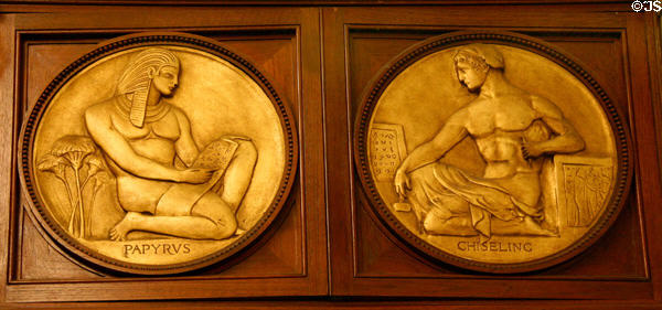 Relief roundels showing Papyrus & Chiseling methods of writing on Rush Rhees Library facade (1927) at University of Rochester. Rochester, NY.