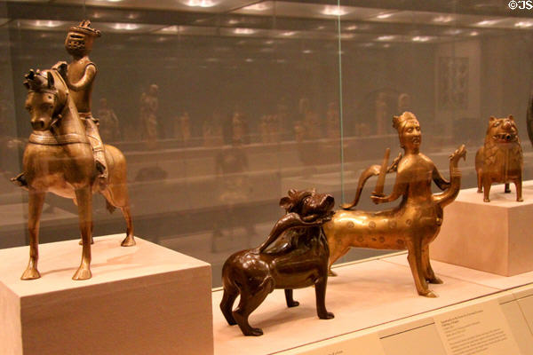 Collection of Middle Ages bronze aquamanili hand washing ewers shaped like lions, mythical beast or other figures at Metropolitan Museum of Art. New York, NY.