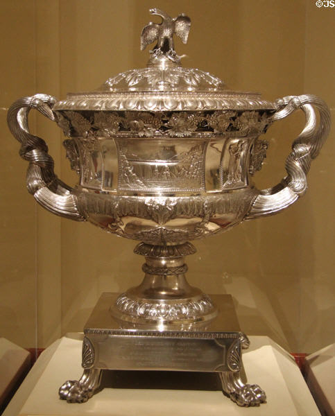 Reverse side of Silver presentation vase with scenes of Erie Canal (1824) by Thomas Fletcher & Sidney Gardiner of Philadelphia at Metropolitan Museum of Art. New York, NY.