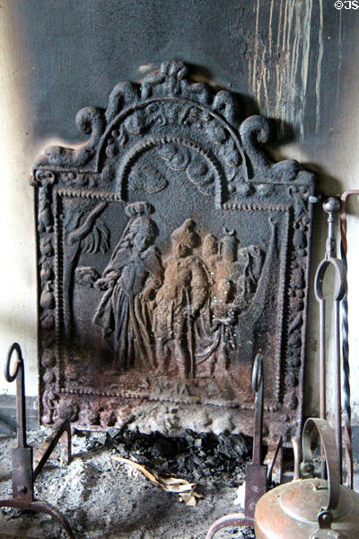 Schenck House kitchen fireplace iron backing at Old Bethpage Village. Old Bethpage, NY.