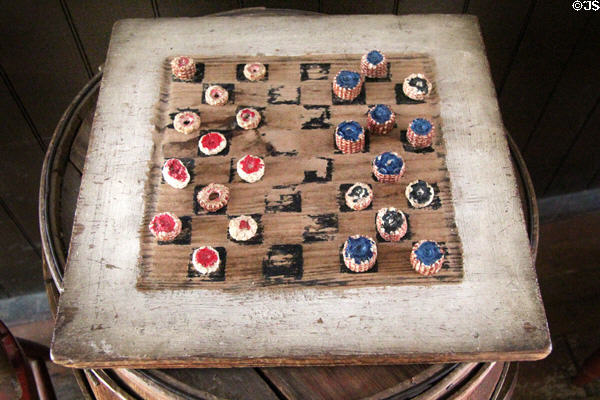 Checker board game corncob pieces in Layton General Store at Old Bethpage Village. Old Bethpage, NY.