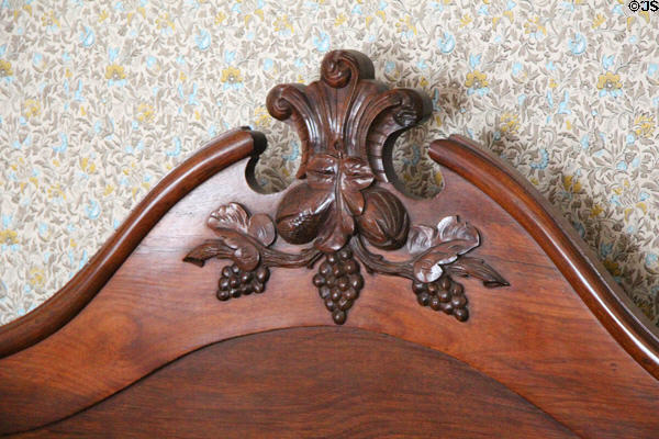 Carved headboard in Layton Home at Old Bethpage Village. Old Bethpage, NY.