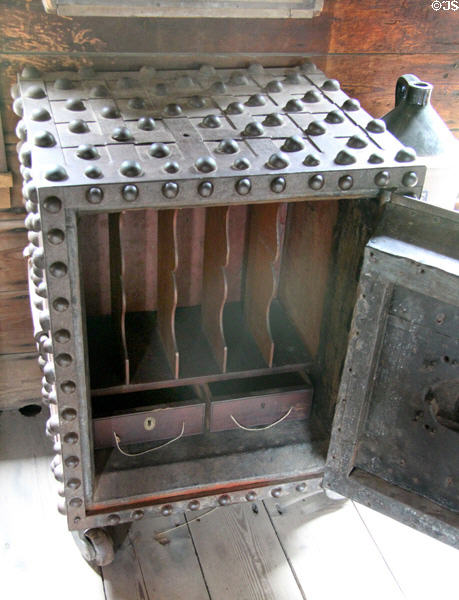 Interior of safe covered with rivets in Luyster Store at Old Bethpage Village. Old Bethpage, NY.