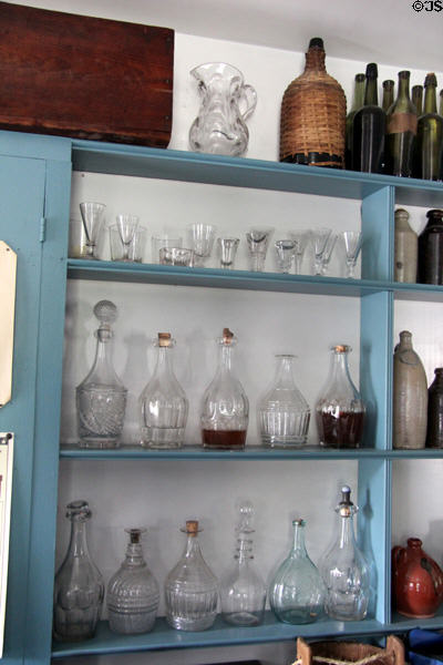 Early American glassware in Noon Inn Barroom at Old Bethpage Village. Old Bethpage, NY.