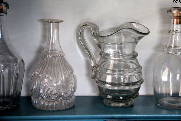 Early American glassware in Noon Inn Barroom at Old Bethpage Village. Old Bethpage, NY.