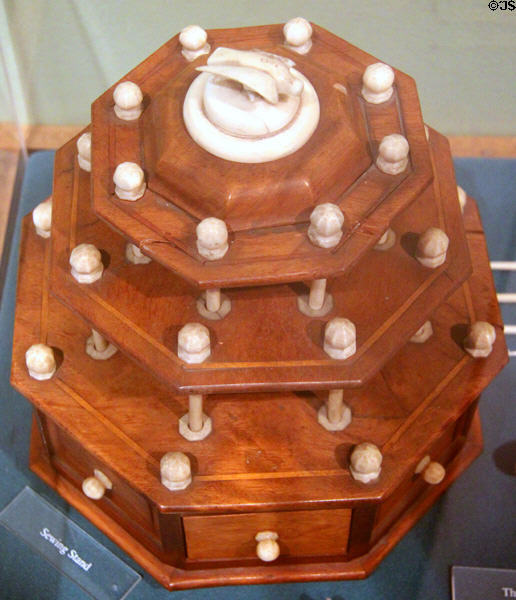 Sewing stand with carved whale ivory pieces at Whaling Museum. Cold Spring Harbor, NY.