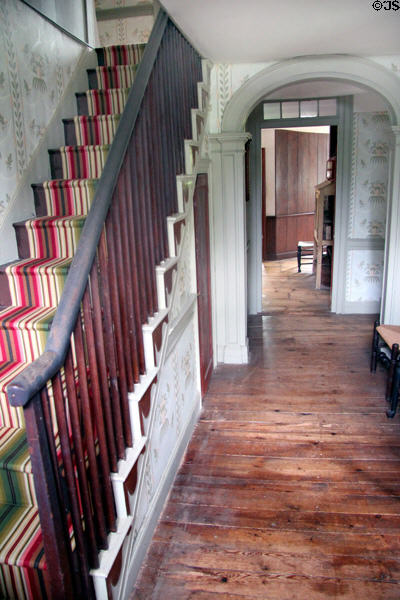 Front hall with vintage narrow stair case at Custom House Museum. Sag Harbor, NY.