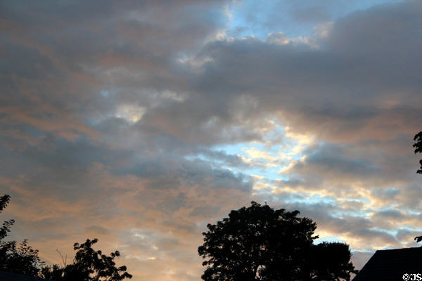 Early evening sky with sunset reflected on storm clouds. Bridgehampton, NY.