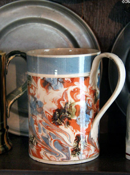Ceramic mug with multicolored flowing pattern at Home Sweet Home Museum. East Hampton, NY.