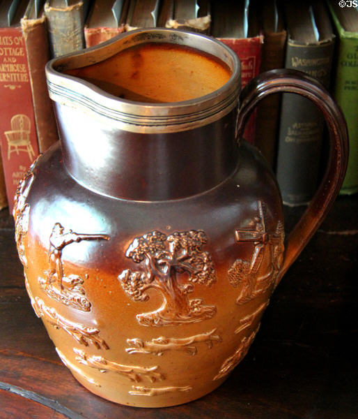 Two-tone brown salt glaze stoneware jug with embossed hunting scene at Home Sweet Home Museum. East Hampton, NY.