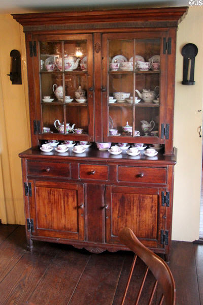Glass fronted kitchen cabinet at Home Sweet Home Museum. East Hampton, NY.