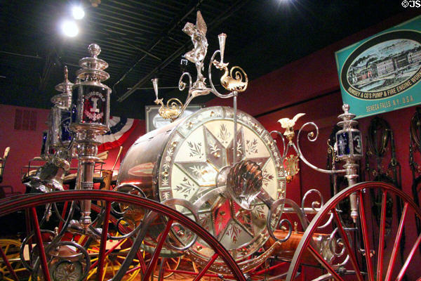 Details of silver lamps & finials on parade hose carriage (1875) by Rumsey Manuf. Co. of Seneca Falls, NY at carriage collection of Long Island Museum. Stony Brook, NY.