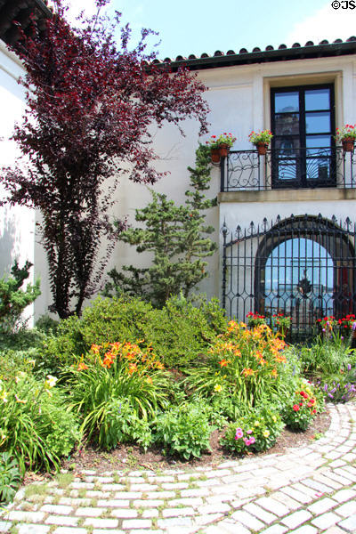 Courtyard garden with gate looking out to sea at Vanderbilt Mansion. Centerport, NY.