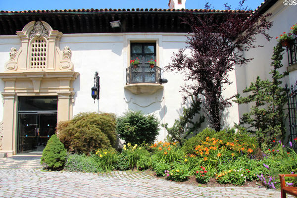 Spanish Baroque entrance with flower garden at Vanderbilt Mansion. Centerport, NY.