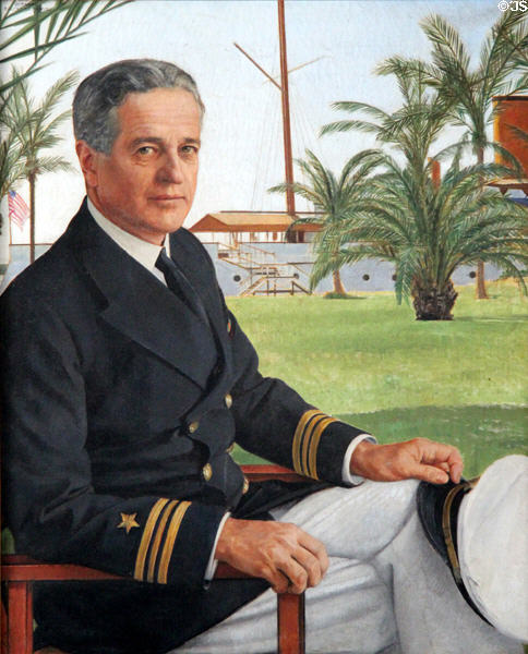 Portrait of William Kissam Vanderbilt II (1878-1944) builder of Vanderbilt Mansion in front of motor yacht Alva. Centerport, NY.