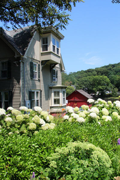 Heritage house with garden in Roslyn Historic District. Roslyn, NY.