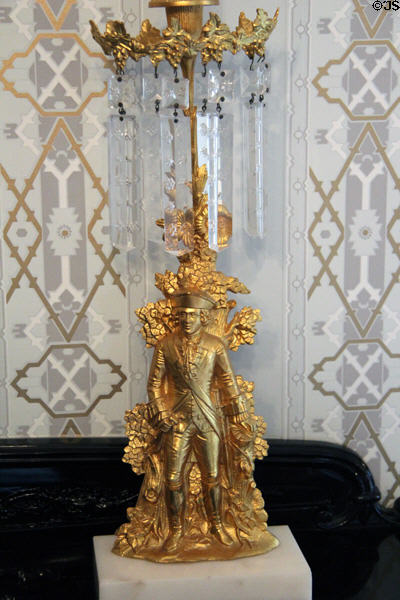 Gilt girandole with relief of man in frock coat & knee breeches at Taft House NHS. Cincinnati, OH.