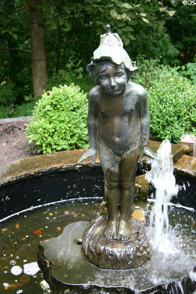 Fountain statue of nymph with leaf hat in Wildwood Manor House gardens. Toledo, OH.