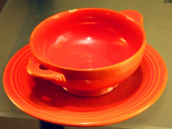 Fiesta ware bowl made orange with uranium oxide glaze (1936-43 or 1959-76) by Homer Laughlin China Co. at Museum of Ceramics. East Liverpool, OH.