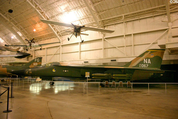 General Dynamics F-111A Aardvark (1964) under Helio U-10D Super Courier STOL at National Museum of USAF. Dayton, OH.