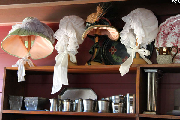 Antique bonnets & tinware in N.K. Whitney Store at Historic Kirtland Village. Kirtland, OH.