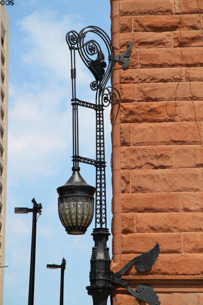 Detail of sculpted ironwork lamp on corner of Society for Savings Building. Cleveland, OH.