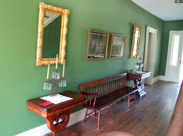 Hallway in Jonathan Goldsmith House with double chair bench, side tables & mirrors at Hale Farm. Cleveland, OH.