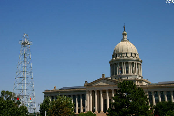Oklahoma State Capitol with pumping oil well on grounds. Oklahoma City, OK.