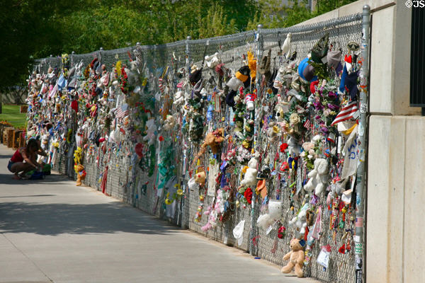 Memorial fence with objects left in memory of bombing victims at Oklahoma City National Memorial. Oklahoma City, OK.