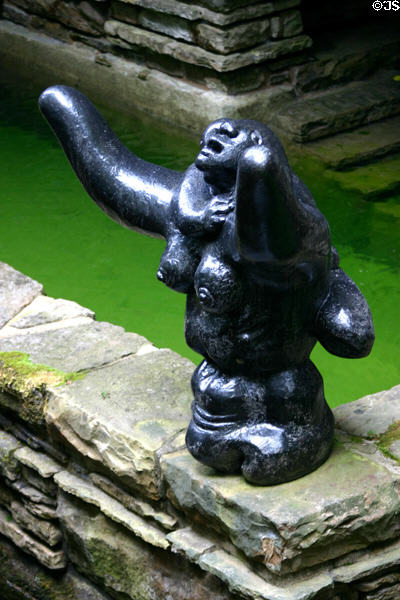 Statue on wall of Fallingwater. Mill Run, PA.