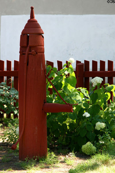 Early American water pump encased in wood. York, PA.