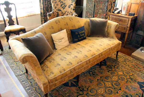 Sofa with pillows written with humorous sayings as placed by Doris Duke in Morning Room at Rough Point. Newport, RI.